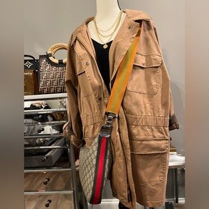 This jacket is made like a shacket the inside has camouflage design sleeves roll